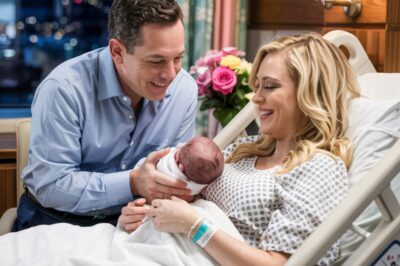 Greg Gutfeld makes surprise visit to Kat Timpf after giving birth and recovering from surgery. Fox News host holds baby, reveals Kat Timpf’s condition and sets return date